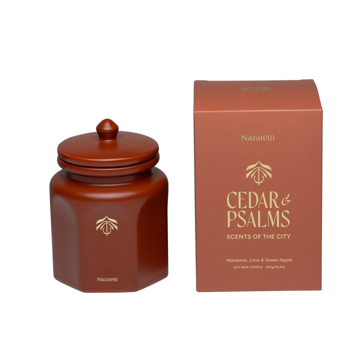 A terracotta ceramic candle vessel with a matching lid next to its terracotta packaging box, both featuring gold lettering for 'Nazareth Cedar & Psalms'.